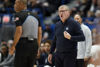 UConn head coach Geno Auriemma, right, calls to an official in the first half of an NCAA college basketball game against Georgetown, Sunday, Jan. 15, 2023, in Hartford, Conn. (AP Photo/Jessica Hill)