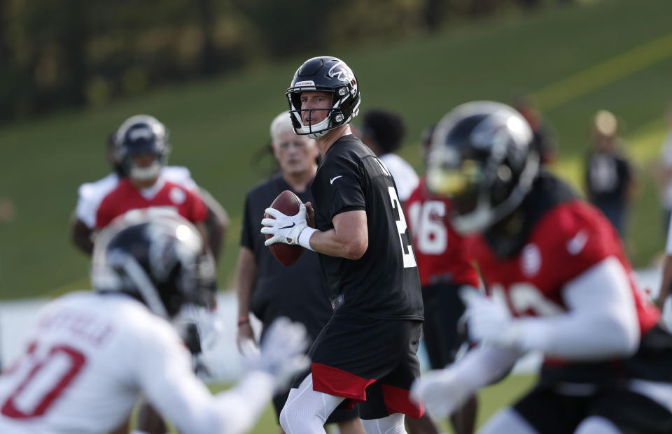 Atlanta Falcons quarterback Matt Ryan (2) looks for an open receiver during their NFL training camp football practice Monday, July 22, 2019, in Flowery Branch, Ga.(AP Photo/John Bazemore)