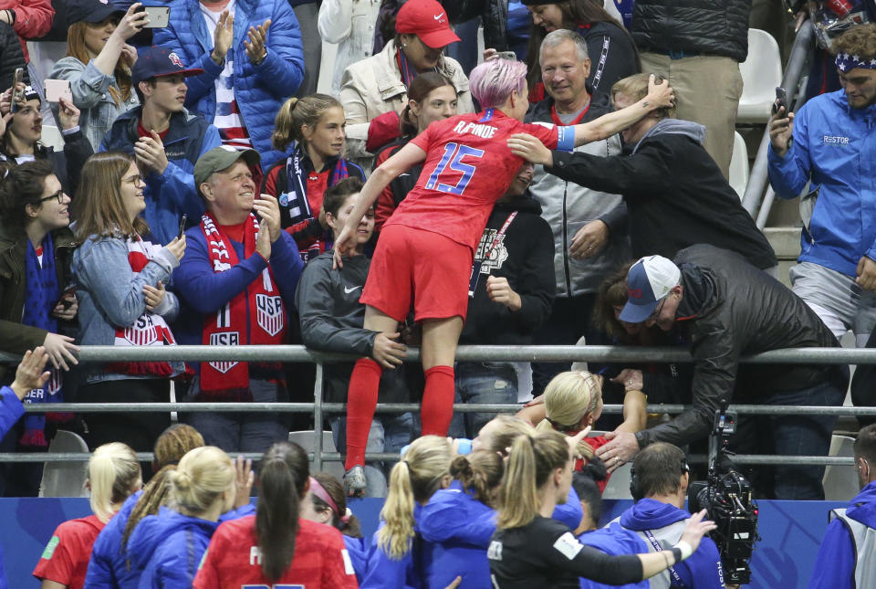 REIMS, FRANCE - JUNE 11: Megan Rapinoe of USA and teammates celebrate the victory with their fans following the 2019 FIFA Women's World Cup France group F match between USA and Thailand at Stade Auguste Delaune on June 11, 2019 in Reims, France. (Photo by Jean Catuffe/Getty Images)