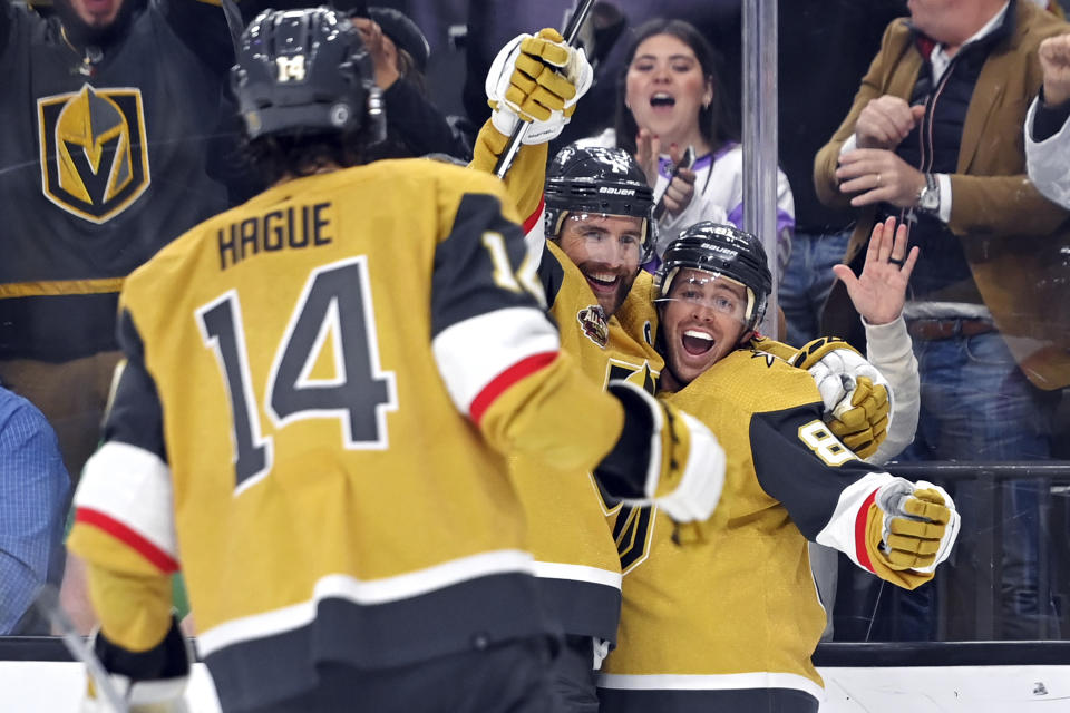 Vegas Golden Knights defenseman Alex Pietrangelo (7) and center Jonathan Marchessault (81) celebrate after Marchessault scored against the Dallas Stars during the second period of an NHL hockey game Wednesday, Dec. 8, 2021, in Las Vegas. (AP Photo/David Becker)