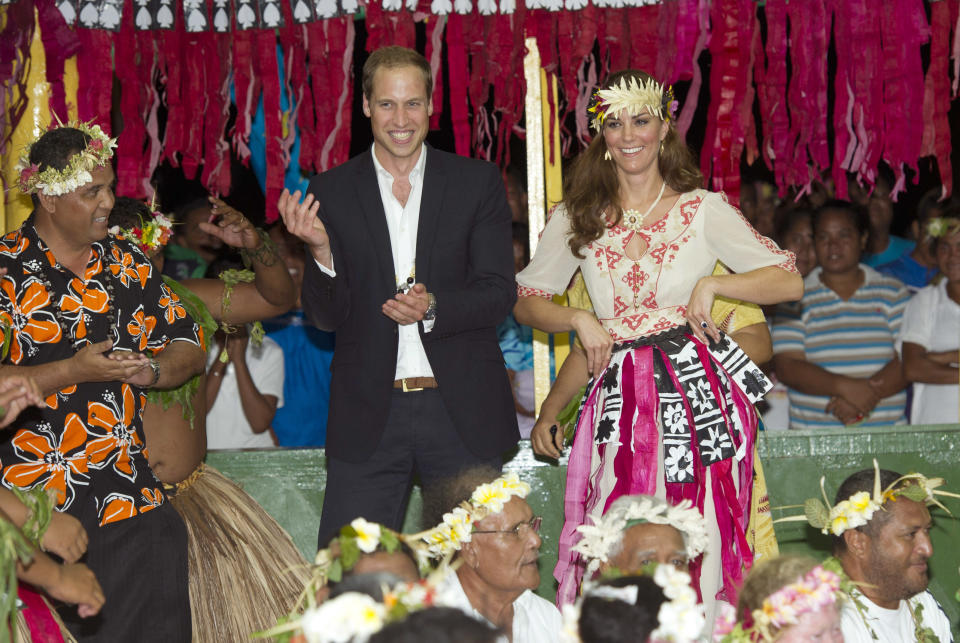 TUVALU - SEPTEMBER 18: Prince William, Duke of Cambridge and Catherine, Duchess of Cambridge dance with the ladies at the Vaiku Falekaupule for an entertainment programme on September 18, 2012 in Tuvalu. Prince William, Duke of Cambridge and Catherine, Duchess of Cambridge are on a Diamond Jubilee tour representing the Queen taking in Singapore, Malaysia, the Solomon Islands and Tuvalu.  (Photo by Arthur Edwards - Pool/Getty Images)