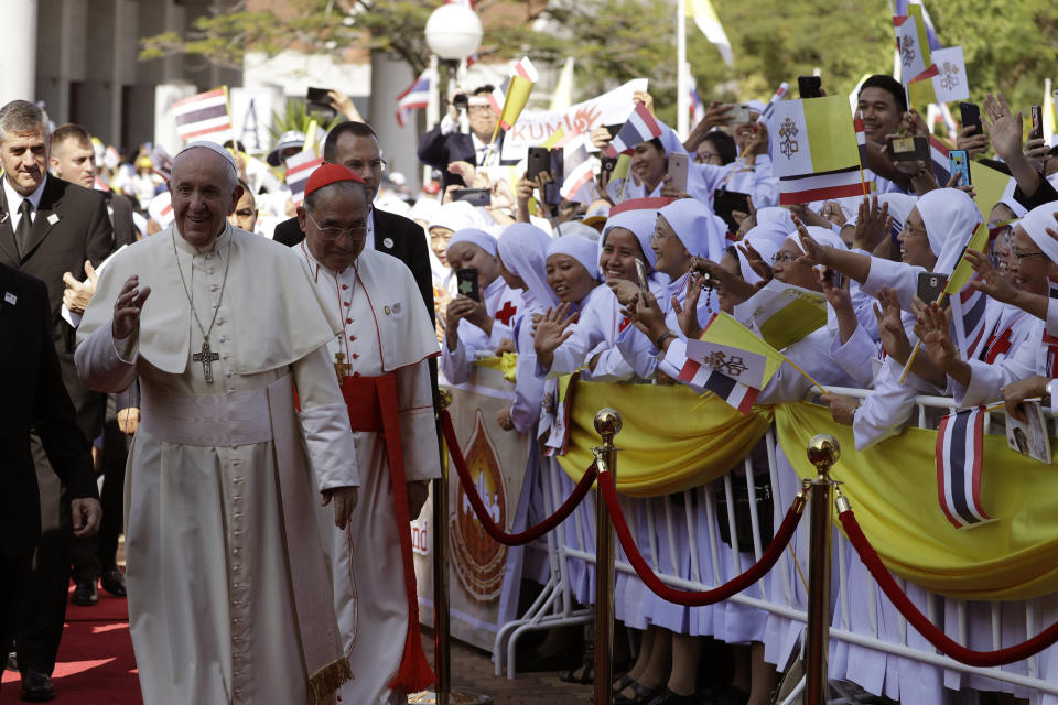 Pope Francis, front, visits St. Peter's Parish, Friday, Nov. 22, 2019, in Bangkok, Thailand. (AP Photo/Gregorio Borgia)