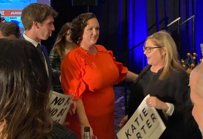 Rep. Katie Porter mixes with supporters at her election night party at the Hilton Orange County in Costa Mesa, Calif.