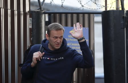 Russian opposition leader Navalny walks out of a detention centre in Moscow