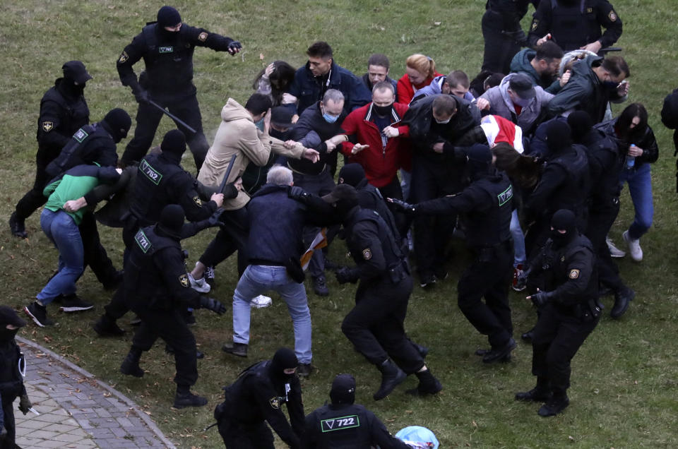 People clash with policemen during an opposition rally to protest the official presidential election results in Minsk, Belarus, Sunday, Oct. 11, 2020. Belarus' authoritarian president Alexander Lukashenko on Saturday visited a prison to talk to opposition activists, who have been jailed for challenging his re-election that was widely seen as manipulated and triggered two months of protests. (AP Photo)