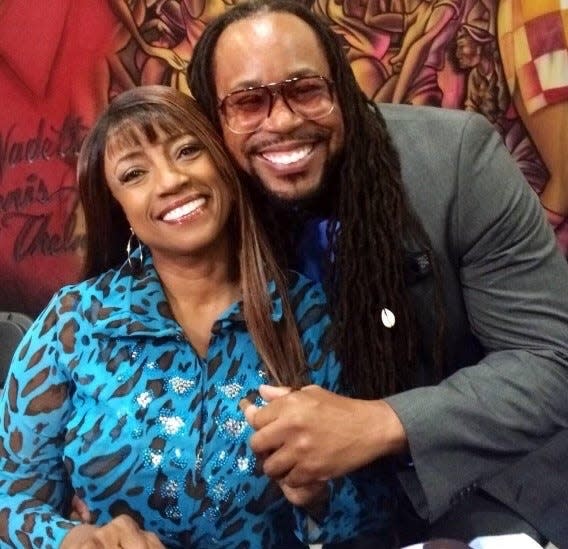 Bern Nadette Stanis, who portrayed Thelma on the original "Good Times" series, poses with James Causey for a photo during the 2014 NABJ conference.