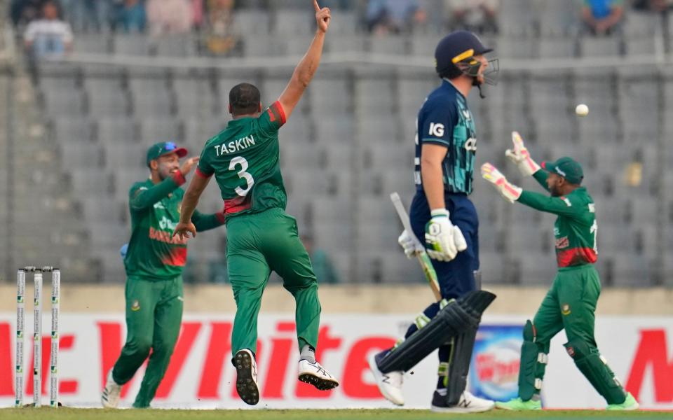 England's Jos Buttler is dismissed – Bangladesh vs England live: score and latest updates from first ODI - Aijaz Rahi/AP