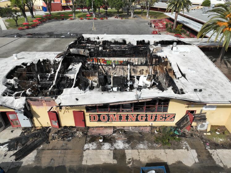 Compton, CA - February 21: Aerial view of the campus of Manuel Dominguez High School in Compton, which is closed today in the aftermath of a massive fire in the cafeteria that sent large plumes of smoke into the air and kept firefighters battling flames for hours. Photo taken Tuesday, Feb. 21, 2023 in Compton. (Allen J. Schaben / Los Angeles Times)