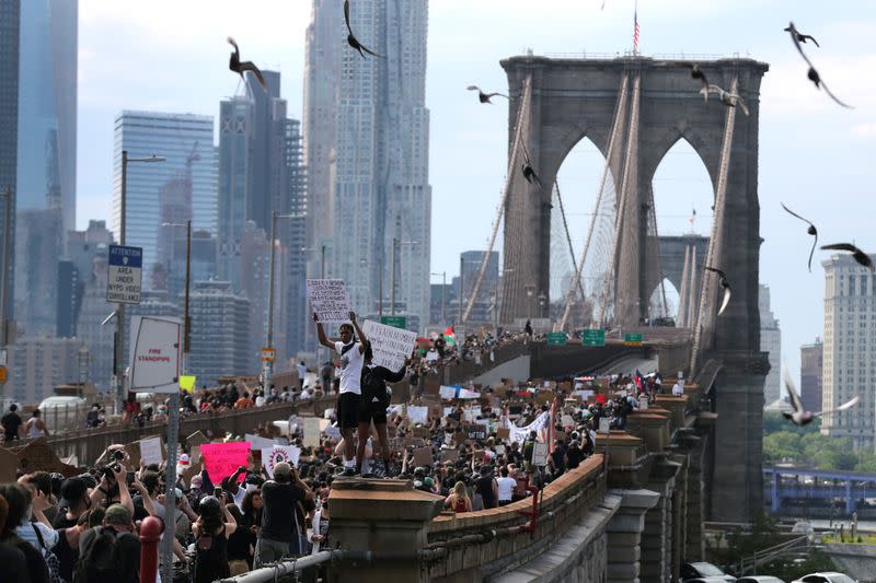 Demonstrators march across Brooklyn Bridge against the death in Minneapolis police custody of George Floyd in Brooklyn New York