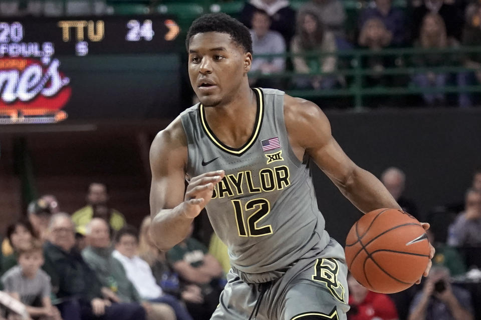 FILE - Baylor's Jared Butler (12) drives against Texas Tech during the first half of an NCAA college basketball game in Waco, Texas, in this Monday, March 2, 2020, file photo. Baylor will begin the college basketball season at No. 2 in the preseason AP Top 25 poll released Monday, Nov. 9, 2020. (AP Photo/Chuck Burton, File)