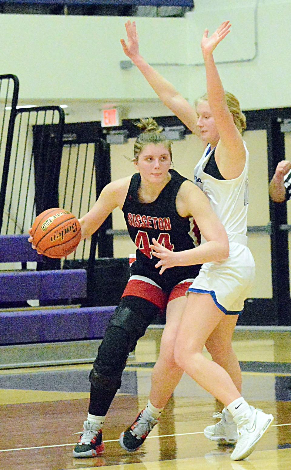 Sisseton's Chloe Langager attempts to move around Sioux Falls Christian's Ellie Lems during their first-round game in the state Class A high school girls basketball tournament on Thursday, March 9, 2023 in the Watertown Civic Arena.