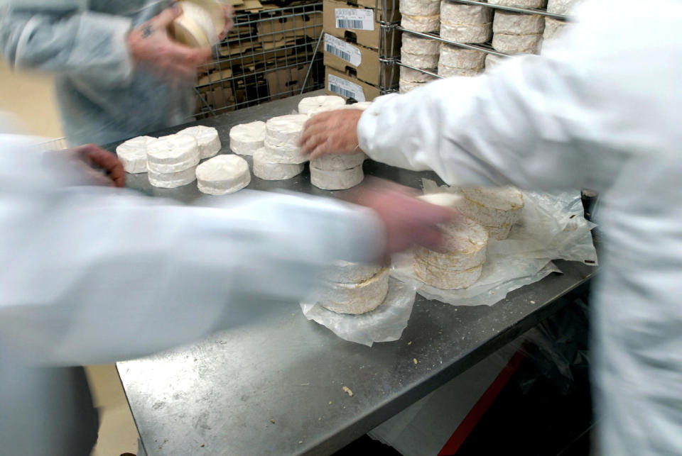 Camembert cheeses being packed into boxes at Isigny Sainte (Alastair Miller/Bloomberg, via Getty Images)