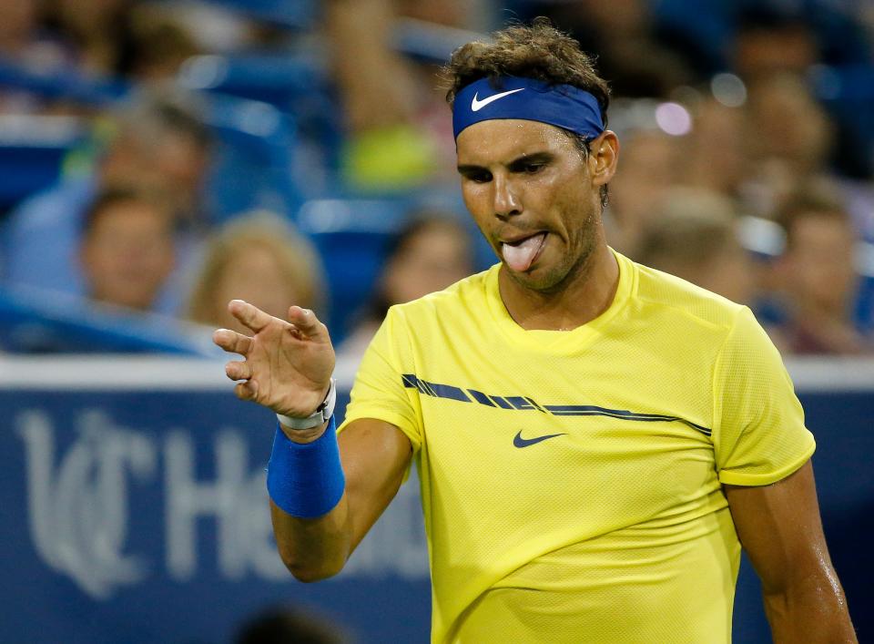 Rafal Nadal waves his hand after giving up a point in the second set of the match between Nick Kyrgios and Rafael Nadal during the Western & Southern Open at the Lindner Family Tennis Center in Mason, Ohio, on Friday, Aug. 18, 2017. The underdog Kyrgios defeated No. 1-seed Nadal in straight sets, 6-2, 7-5.