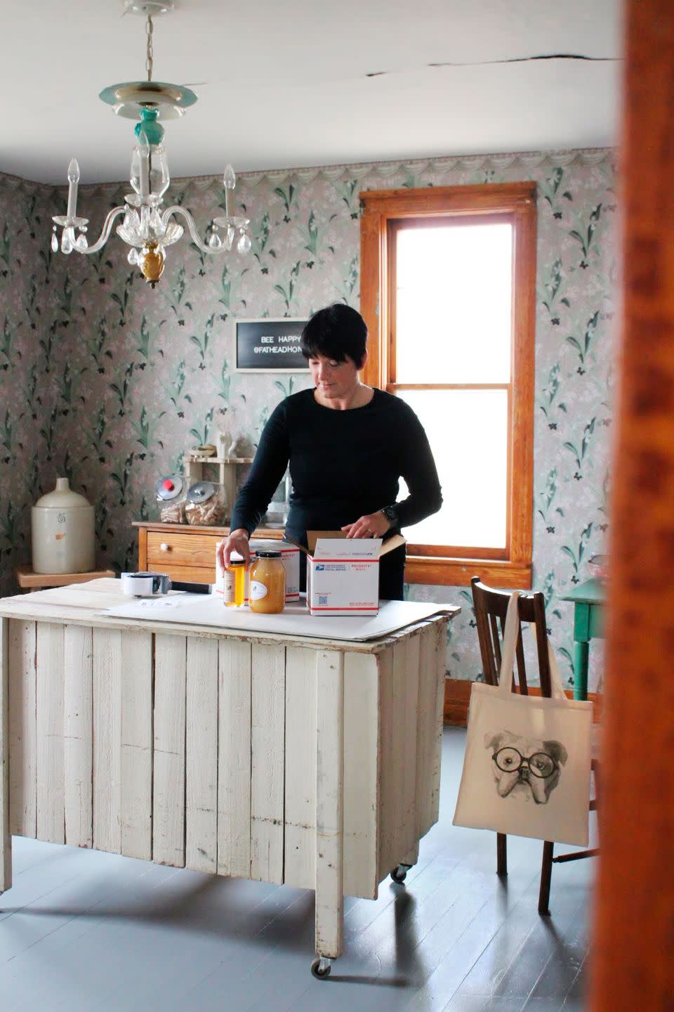 kathy suchan, packing honey in her shipping room