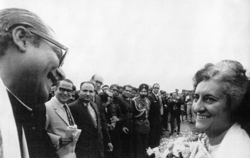 FILE - In this Feb. 6, 1972, file photo, Indian Prime Minister Indira Gandhi, right, welcomes Bangladesh Prime Minister Sheikh Mujibur Rahman, left, as he arrives on a two- day visit to India at the Calcutta airport in India. Bangladesh is celebrating 50 years of independence this year. (AP Photo, File)