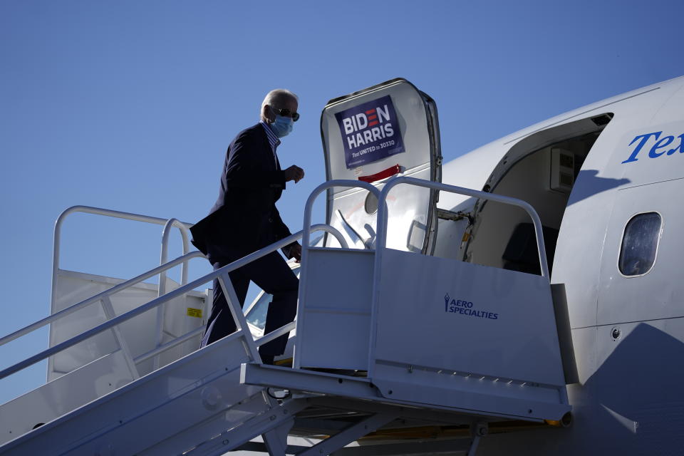 Democratic presidential candidate former Vice President Joe Biden boards his campaign plane at New Castle Airport in New Castle, Del., Thursday, Oct. 8, 2020., en route to Arizona. (AP Photo/Carolyn Kaster)