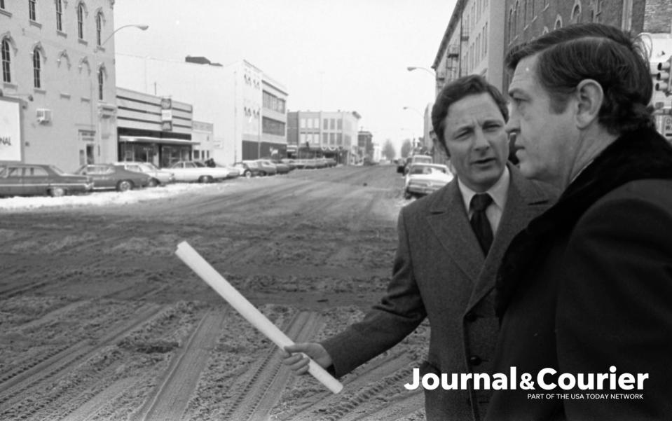 U.S Senator Birch Bayh discusses Railroad Relocation wiht Lafayette mayor Jim Riehle on Fifth Street. Photo taken Jan. 12, 1974.