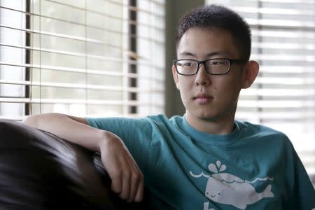 Shane Bang, 21, poses for a portrait at home in Federal Way, Washington August 8, 2015. With his parents out of work and an office job paying his bills, college junior Shane Bang remembers the anxiety he felt when his younger brother told his family he was headed to University of Washington in the fall. REUTERS/Jason Redmond