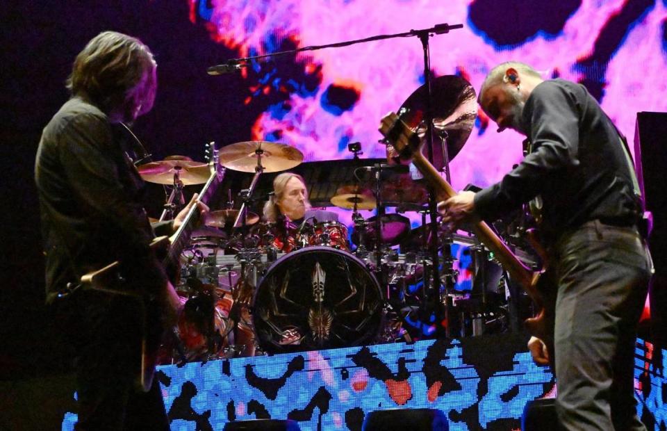 Tool’s guitarist Adam Jones, left, drummer Georg Edert, center, and bassist Justin Chancellor, right, perform at the Save Mart Center Monday, Feb 12, 2024 in Fresno.