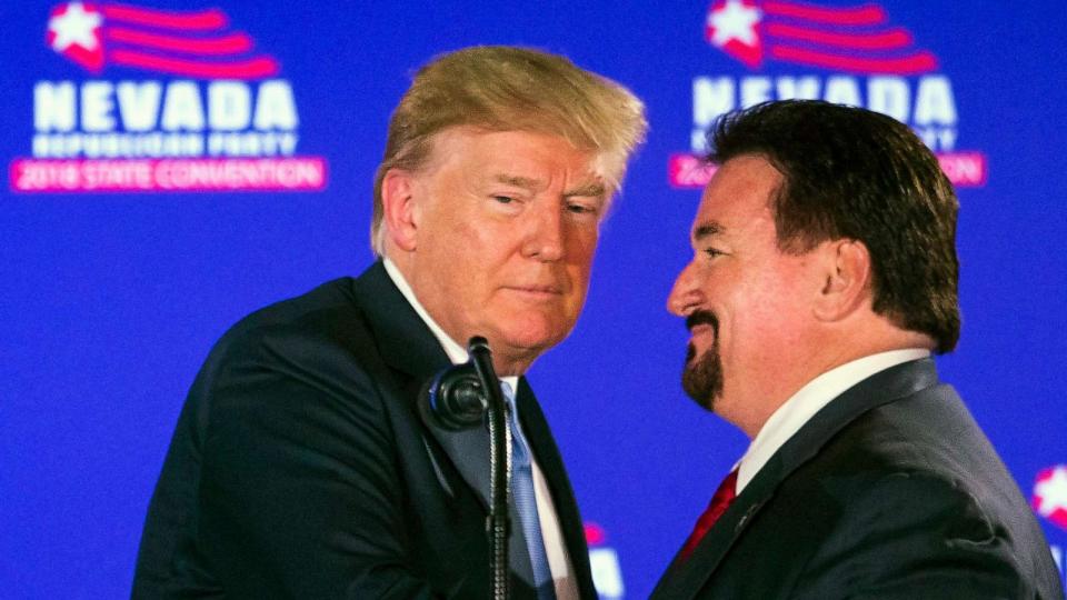 PHOTO: In this June 23, 2018, file photo, President Trump, left, is greeted by Nevada State GOP Chairman Michael McDonald as he arrives at the podium to speak during the Nevada Republican Party Convention at the Suncoast Hotel and Casino in Las Vegas. (L. E. Baskow/AP, FILE)