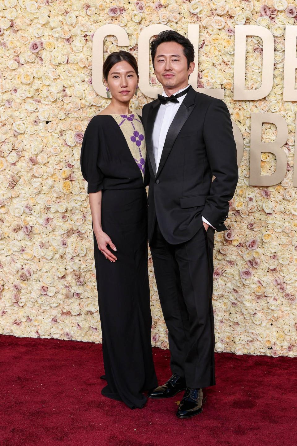 Joana Pak and Steven Yeun attend the 2024 Golden Globes.