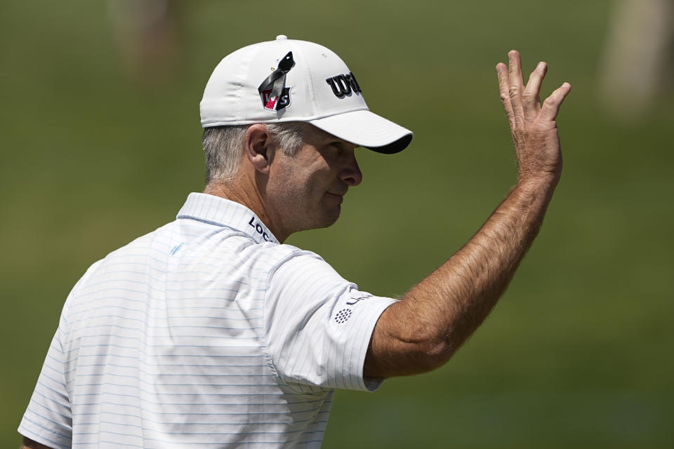Kevin Streelman waves after his putt on the 18th hole during first round of the Wells Fargo Championship golf tournament at the Quail Hollow Club on Thursday, May 4, 2023, in Charlotte, N.C. (AP Photo/Chris Carlson)