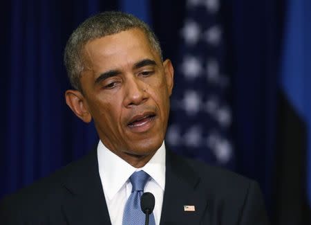 U.S. President Barack Obama pauses during a news conference at the Bank of Estonia in Tallinn, September 3, 2014. REUTERS/Larry Downing