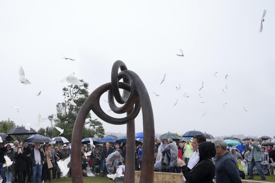 Doves are released during a memorial ceremony in Sydney, Australia, Wednesday, Oct. 12, 2022, honoring the victims of the 2002 Bali bombing that killed 202 people, mostly foreign tourists, including 88 Australians, and seven Americans. (AP Photo/Rick Rycroft)