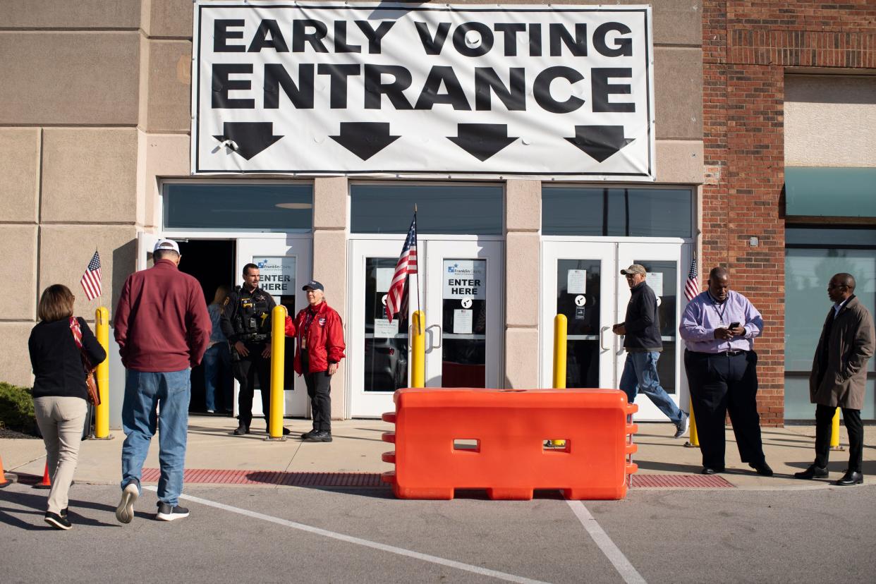 A steady flow of voters makes their way in to vote at the Franklin County Board of Elections during the first hours of the first day of early voting Wednesday for the Nov. 7 general election.