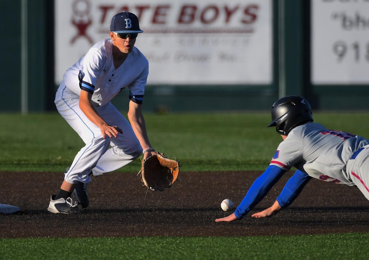 Bartlesville High School's Damien Niko (8) slides into third base during baseball action against Bixby in Bartlesville on March 15, 2024.