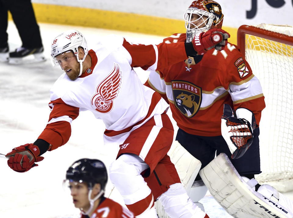 Detroit Red Wings right wing Anthony Mantha (39) crosses the path of Florida Panthers goaltender Sergei Bobrovsky (72) during the first period of an NHL hockey game Tuesday, Feb. 9, 2021, in Sunrise, Fla. (AP Photo/Jim Rassol)