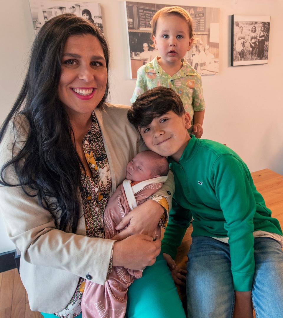 Toni Calderone with her children, from the left, baby Lina, Aviano, age 10, and Vincenzo, age 2 at her restaurant Aviano's Corner Trattoria in York. 