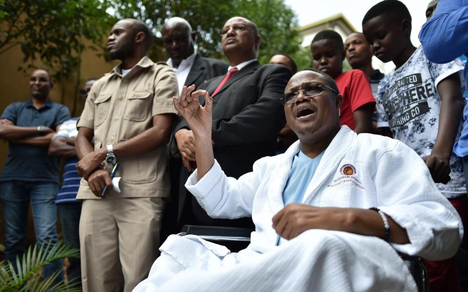 Tanzanian main opposition chief Tundu Lissu gestures from his wheelchair on January 5, 2018 in Nairobi, after he was shot 16 times by unknown gunmen with Kalashikovs. - TONY KARUMBA/AFP via Getty Images