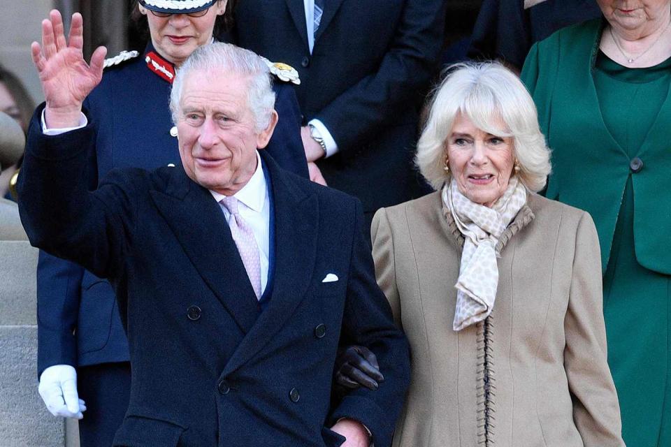 OLI SCARFF/AFP via Getty Images King Charles and Queen Camilla