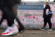National Covid Memorial Wall, a dedication of thousands of hand painted hearts and messages commemorating victims of the COVID-19 pandemic, is seen in London