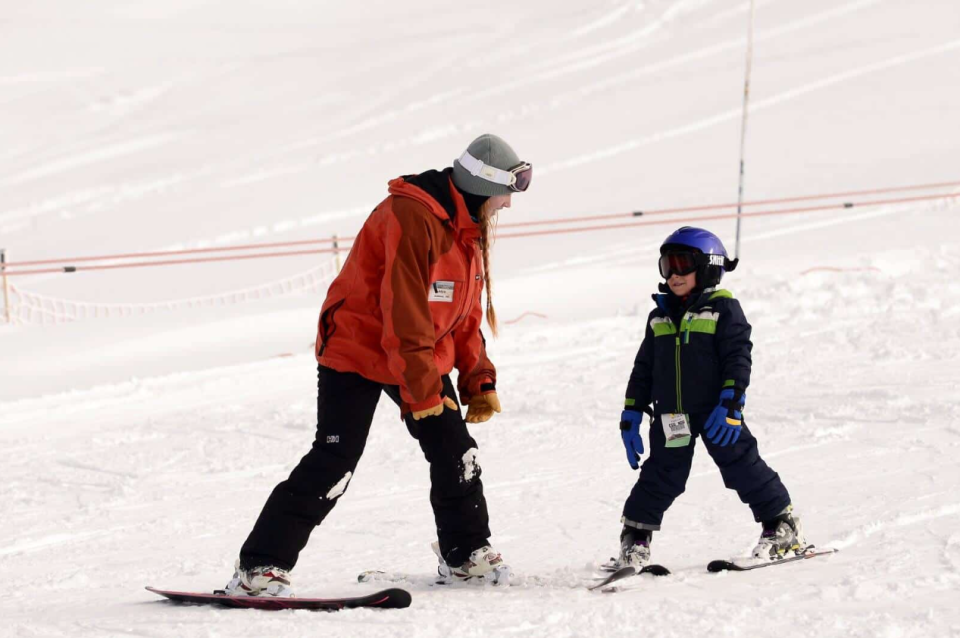 A young skier gets a lesson from an instructor at Mt. Ashland Ski Area. The park had 9 feet and 9 inches of snow at the bottom of the mountain, 10.5 feet at the top, on Thursday, March 23, 2023.