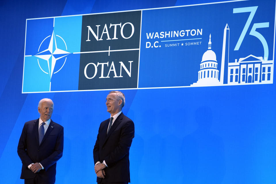 President Joe Biden and NATO Secretary General Jens Stoltenberg, right, stand on stage to welcome leaders to the NATO Summit, Wednesday, July 10, 2024, in Washington. (AP Photo/Evan Vucci)