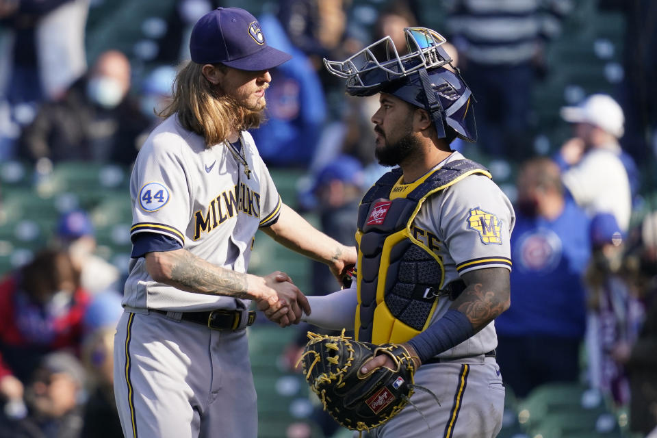 Milwaukee Brewers relief pitcher Josh Hader, left, celebrates with catcher Omar Narvaez after they defeated the Chicago Cubs in a baseball game in Chicago, Saturday, April 24, 2021. (AP Photo/Nam Y. Huh)