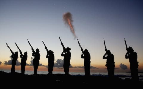 Members of the Albert Battery shoot a volley of fire during the Anzac dawn service at Currumbin Surf Life Saving Club in Australia - Credit: Chris Hyde/Getty Images