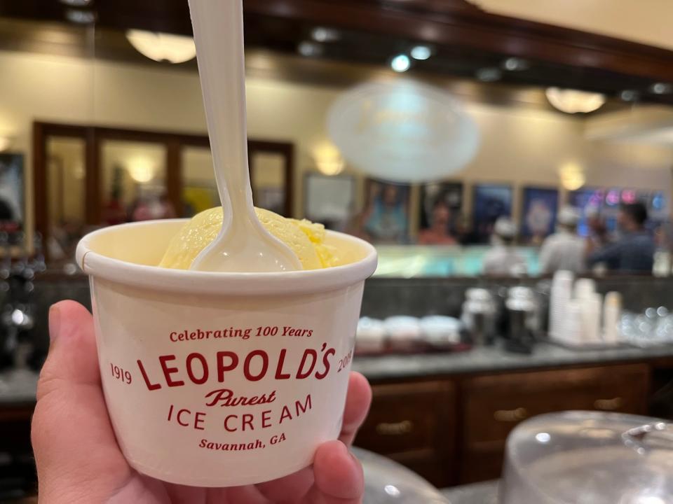 hand holding cup of leopolds ice cream from a shop in savannah georgia