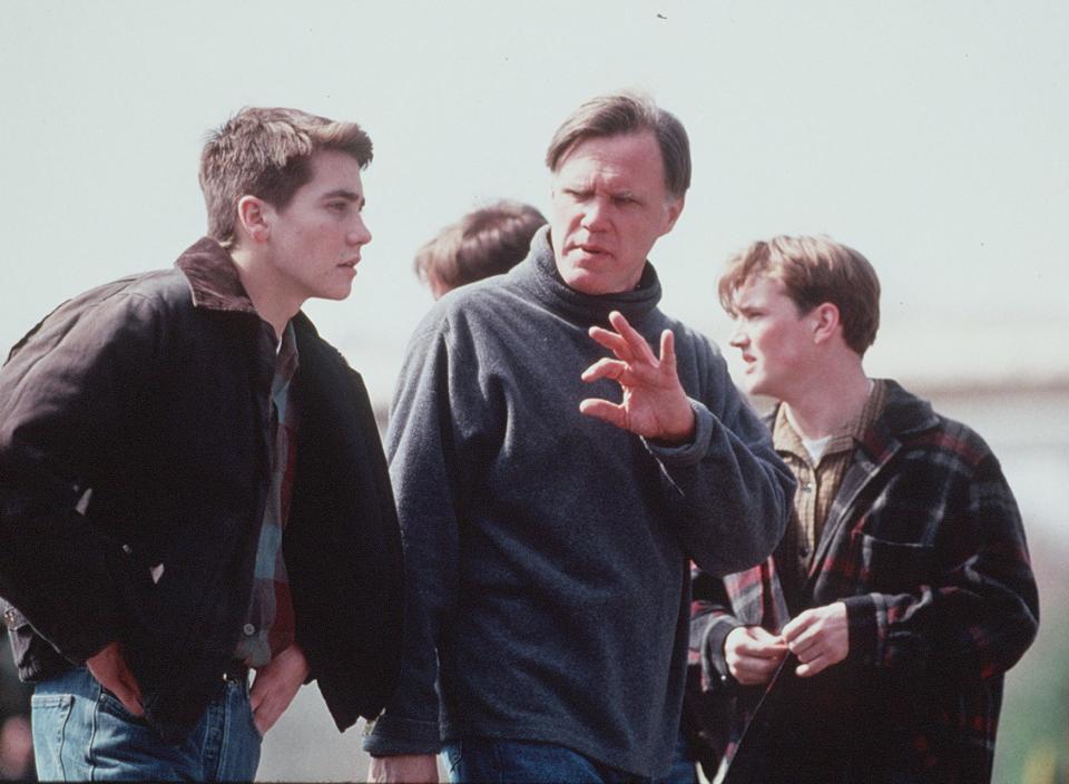 Director Joe Johnston, center, talks with actor Jake Gyllenhaal, left, during the filming of "October Sky" in Oliver Springs.