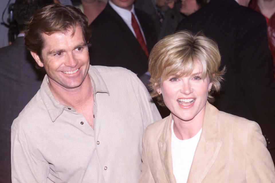 Anthea Turner and her husband Grant Bovey arriving for the World premiere of 'Inbetweeners' at The Prince Charles Cinema in London's Leicester Square in 2003 (Credit: PA)