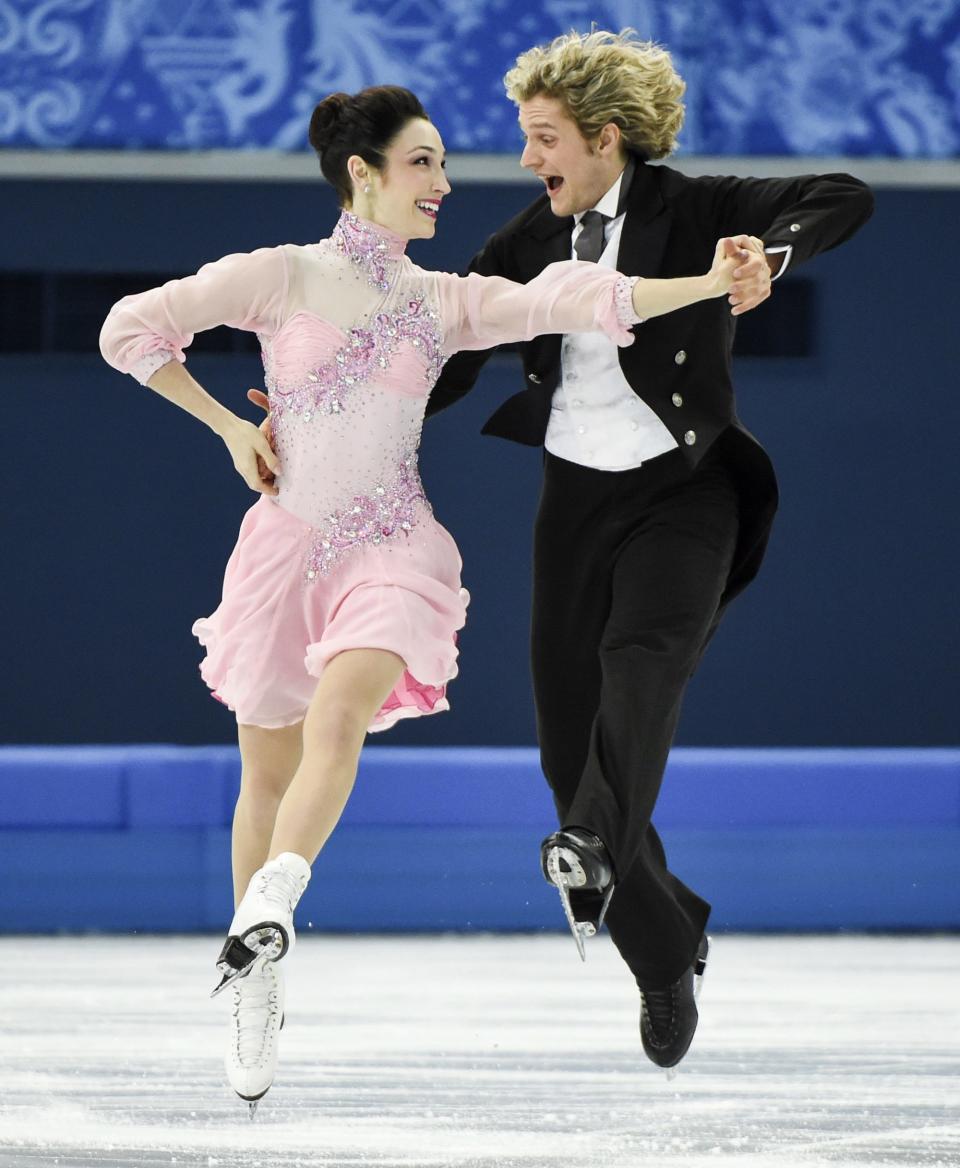 Meryl Davis, left, and Charlie White, of the United States, compete in the ice dance short dance figure skating competition at the Iceberg Skating Palace during the Winter Olympics, Sunday, Feb. 16, 2014, in Sochi, Russia. (AP Photo/The Canadian Press, Paul Chiasson)
