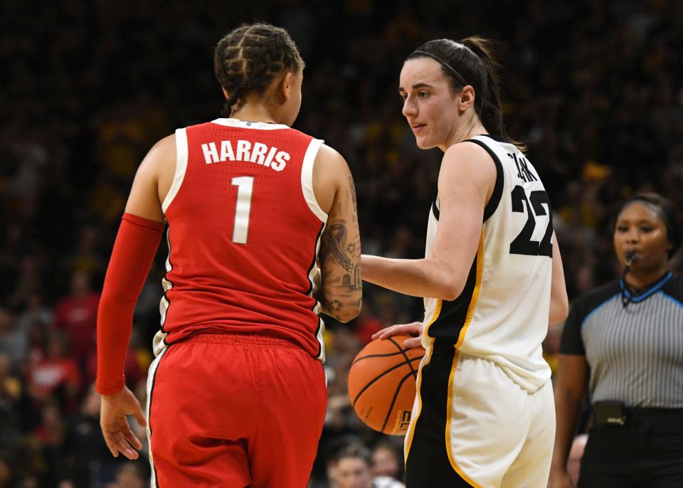 Ohio State's Rikki Harris and Iowa's Caitlin Clark talk as the clock runs out on Sunday.