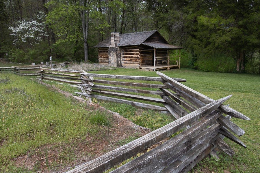 A view of some of the historic cabins at Marble Springs historic state site.