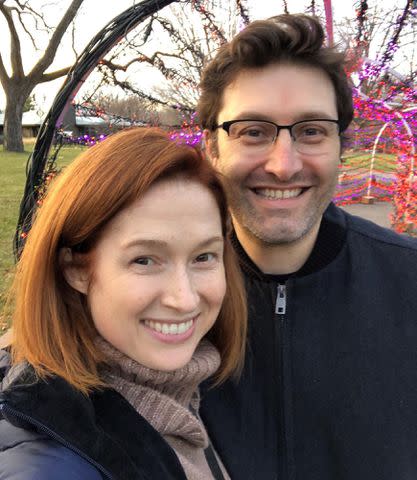 Ellie Kemper Instagram Ellie Kemper and her husband, Michael Koman, take a selfie outdoors.