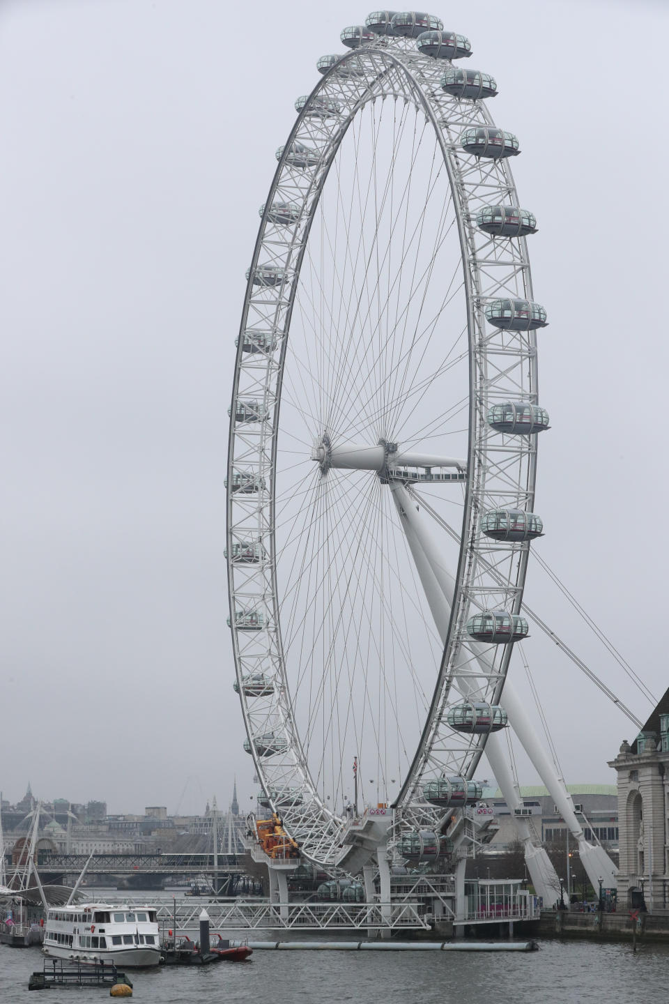 The London Eye is empty of people after NHS England announced that the coronavirus death toll had reached 104 in the UK.