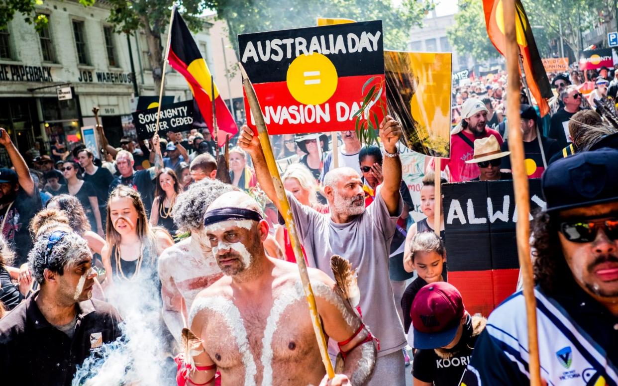 Protesters march during a protest by Aboriginal rights activists on Australia Day in January - Anadolu