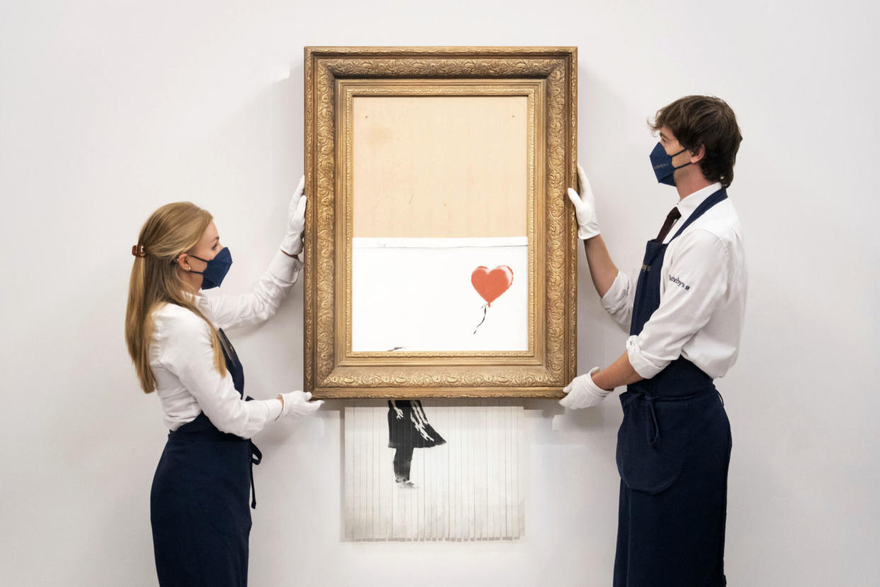 British artist Banksy's half-shredded painting, 'Love is in the Bin' sells for $25 million