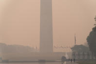 <p>With the Washington Monument in the background and with a thick layer of smoke people run at the National mall Thursday, June 8, 2023, in Washington. Intense Canadian wildfires are blanketing the northeastern U.S. in a dystopian haze, turning the air acrid, the sky yellowish gray and prompting warnings for vulnerable populations to stay inside. (AP Photo/Jose Luis Magana)</p> 